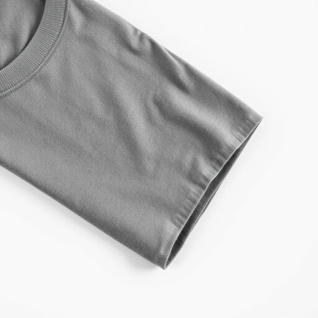 Folded crew-neck t-shirt with visible fabric texture on a clean light background