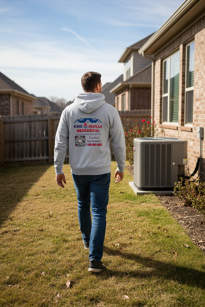 HVAC Technician wearing King Squilla Mechanical sport grey hoodie walking to AC unit